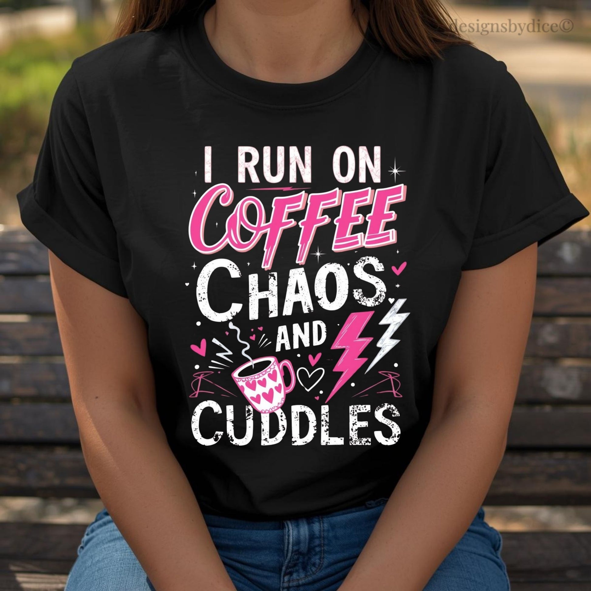 Person wearing a black t-shirt with 'I Run on Coffee, Chaos, and Cuddles' text and graphics.