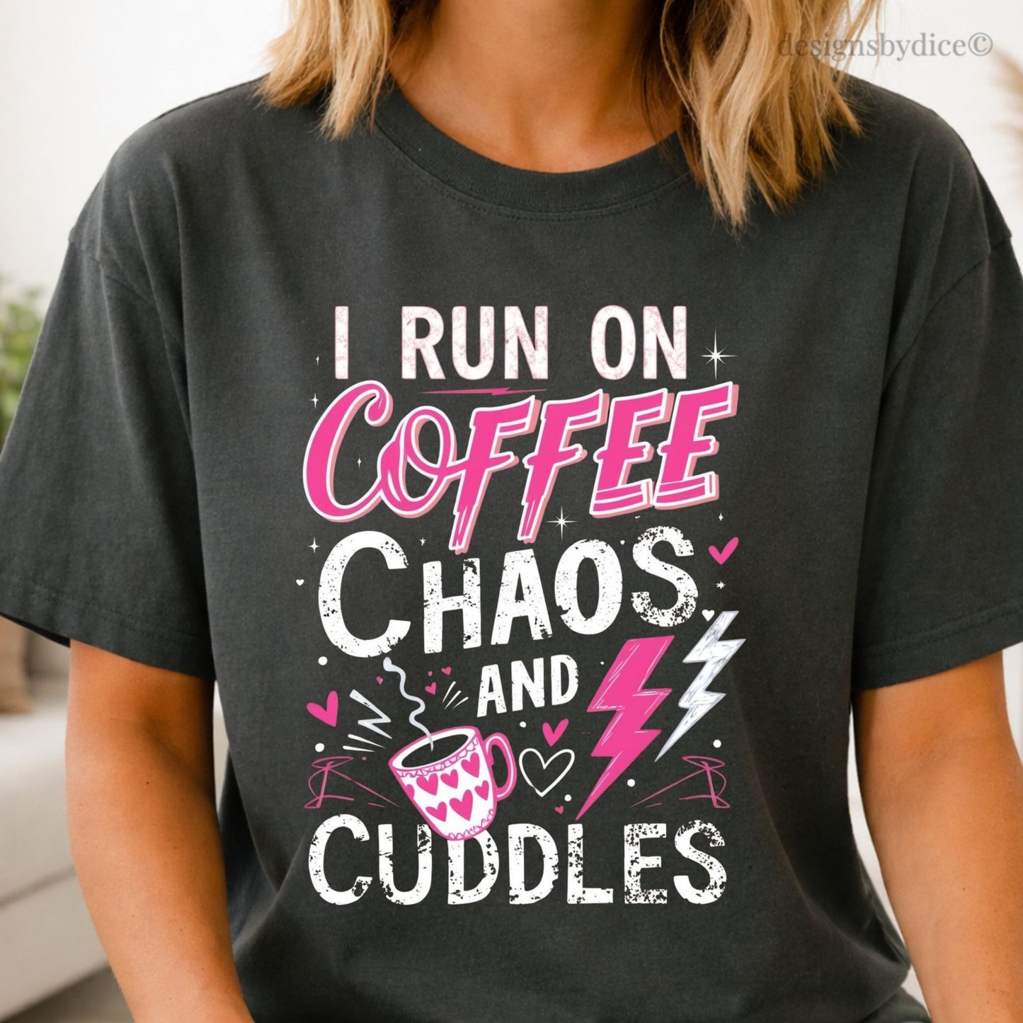 graphite t-shirt with colorful text 'I Run on Coffee, Chaos, and Cuddles' worn by a person.