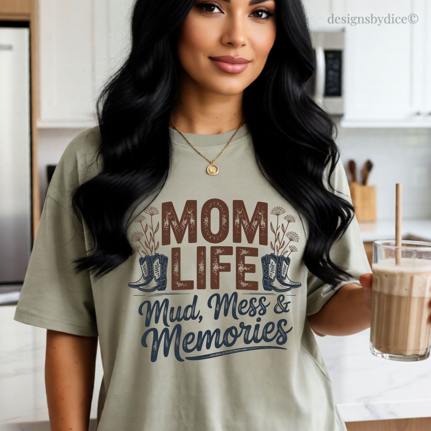 Woman wearing a 'Mom Life Mud, Mess & Memories' t-shirt in a kitchen.