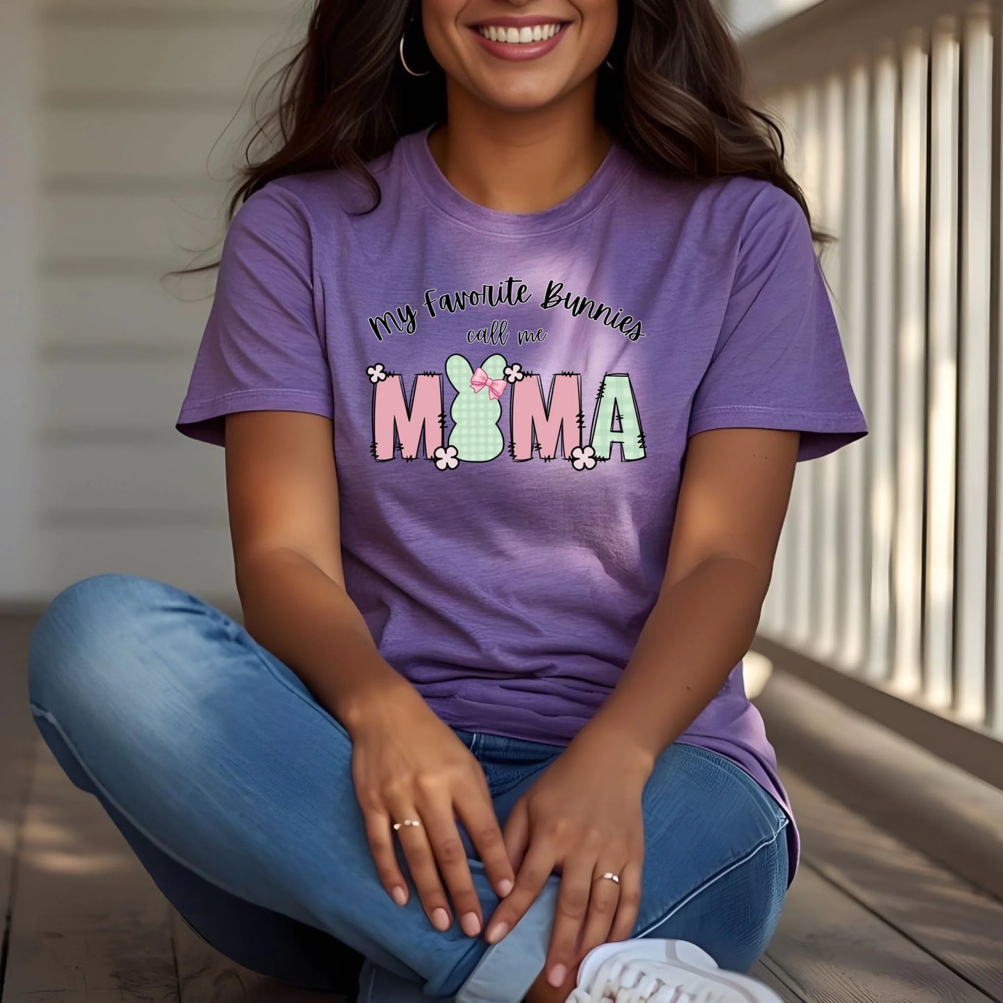 Woman wearing a lavender Bella Canvas t-shirt featuring a “My Favorite Bunnies Call Me Mama” Easter bunny design, casual spring outfit.