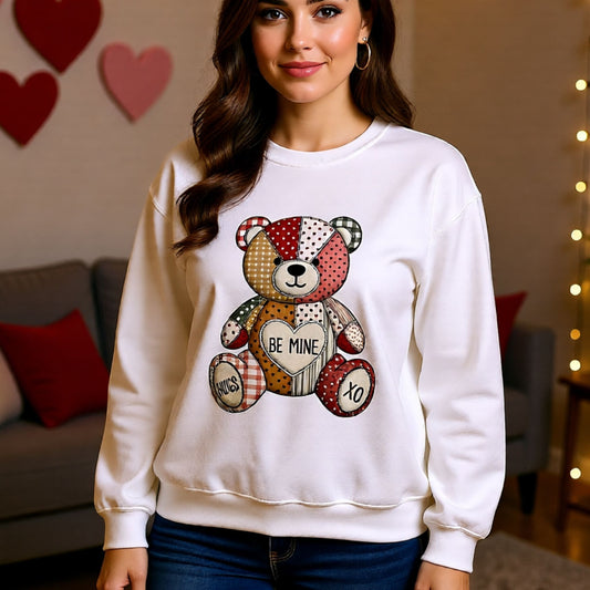 White unisex crewneck featuring cute multicolor patchwork teddy bear and Be Mine Valentine graphic.