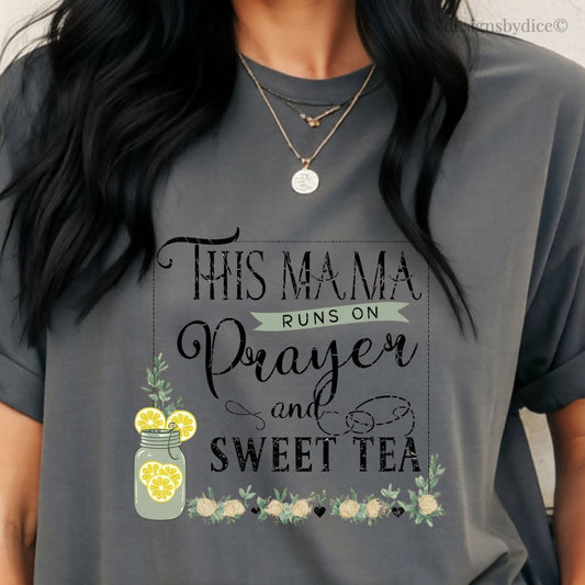 Gray t-shirt with text 'This mama runs on prayer and sweet tea' and graphics.