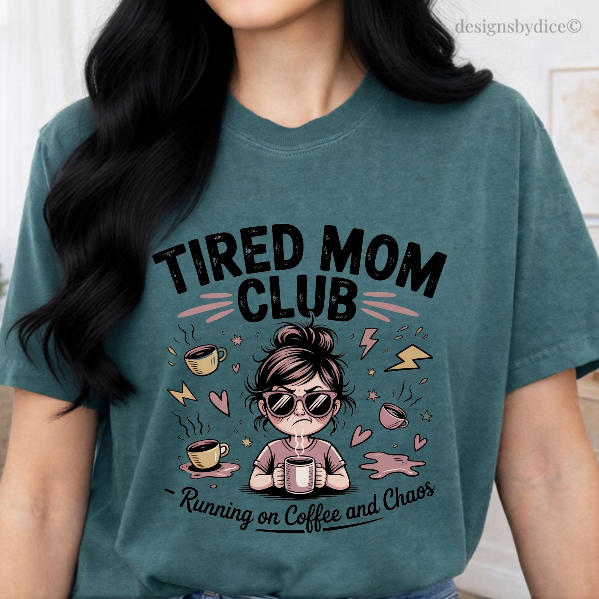Person wearing a teal t-shirt with 'Tired Mom Club' graphic design.