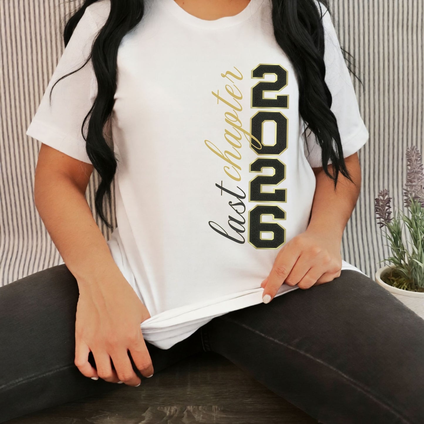 Person wearing a white t-shirt with '2026 last chapter' text.